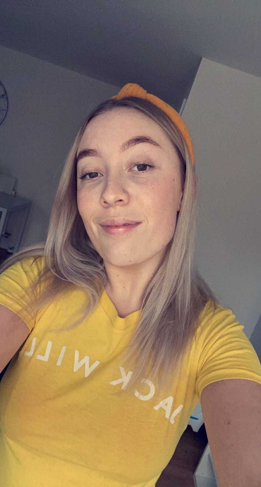 endometriosis warrior taking a selfie while wearing a headband