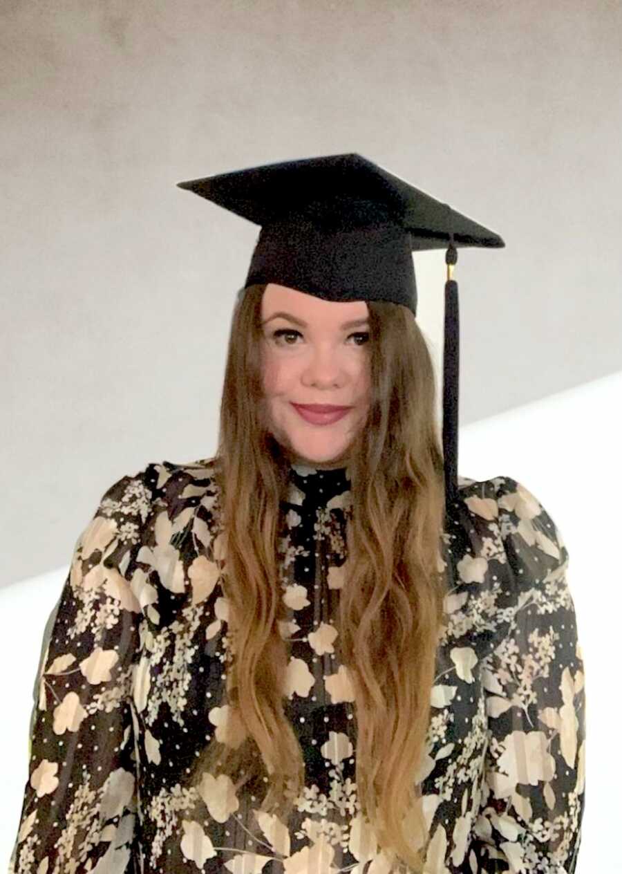 Epilepsy warrior wears a cap for graduation and smiles softly