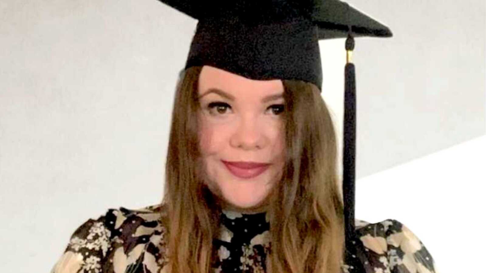 woman with epilepsy in graduation cap