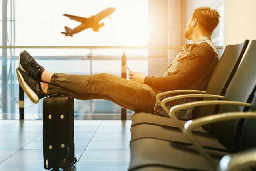 man sits in airport
