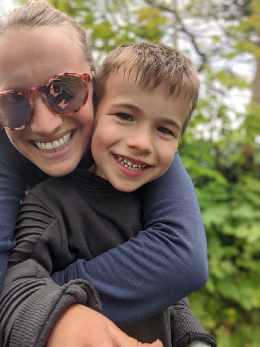 mom hugs son with epilepsy while taking a selfie