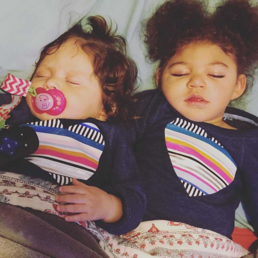 special needs daughter and sister in matching pajamas while sleeping