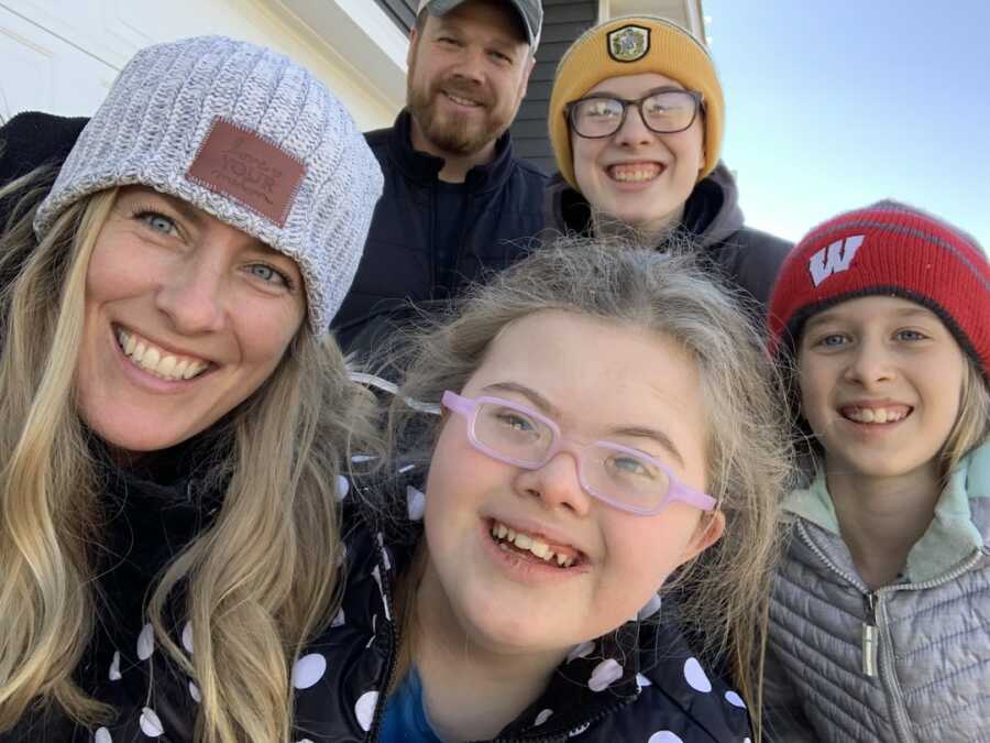 sober special needs mom with husband and three children taking selfie