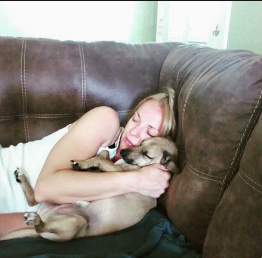 woman and dog on couch