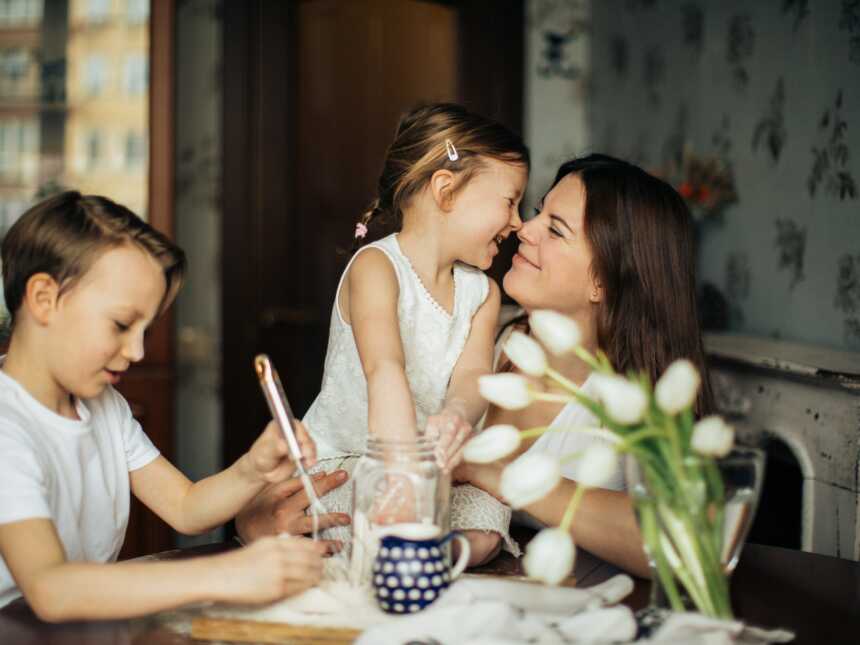 mother at table with son and daughter