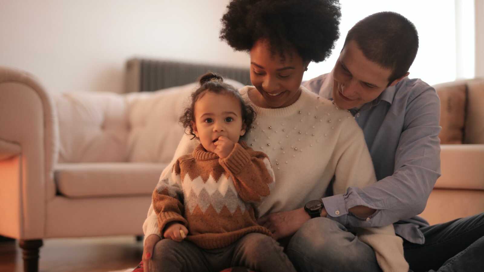 couple gazing at toddler child