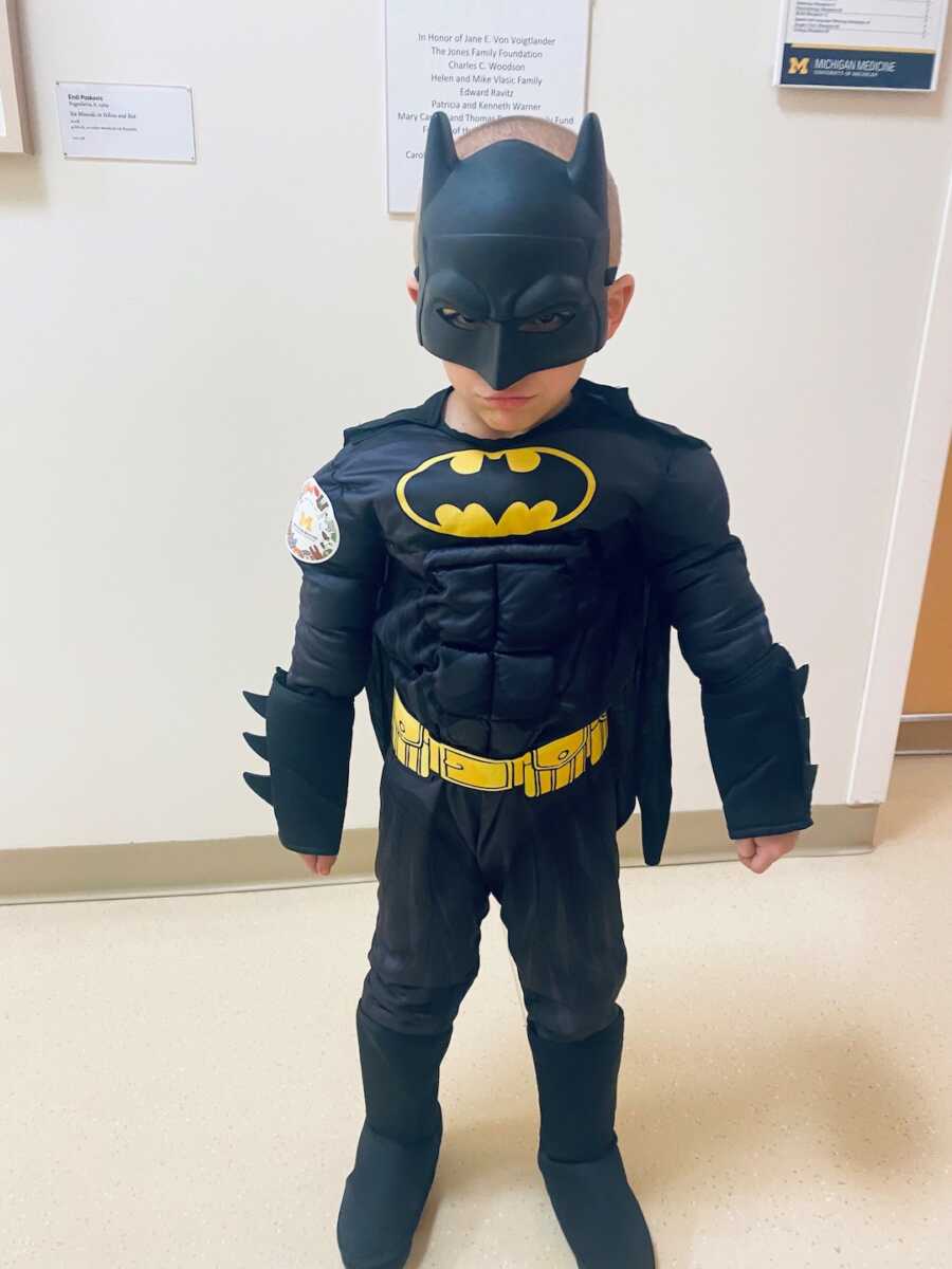 Little boy with cancer poses in Batman costume